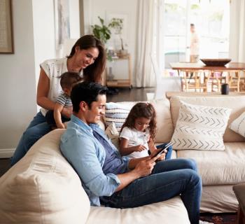 Happy family enjoying their home after scheduling a Marshall ac repair