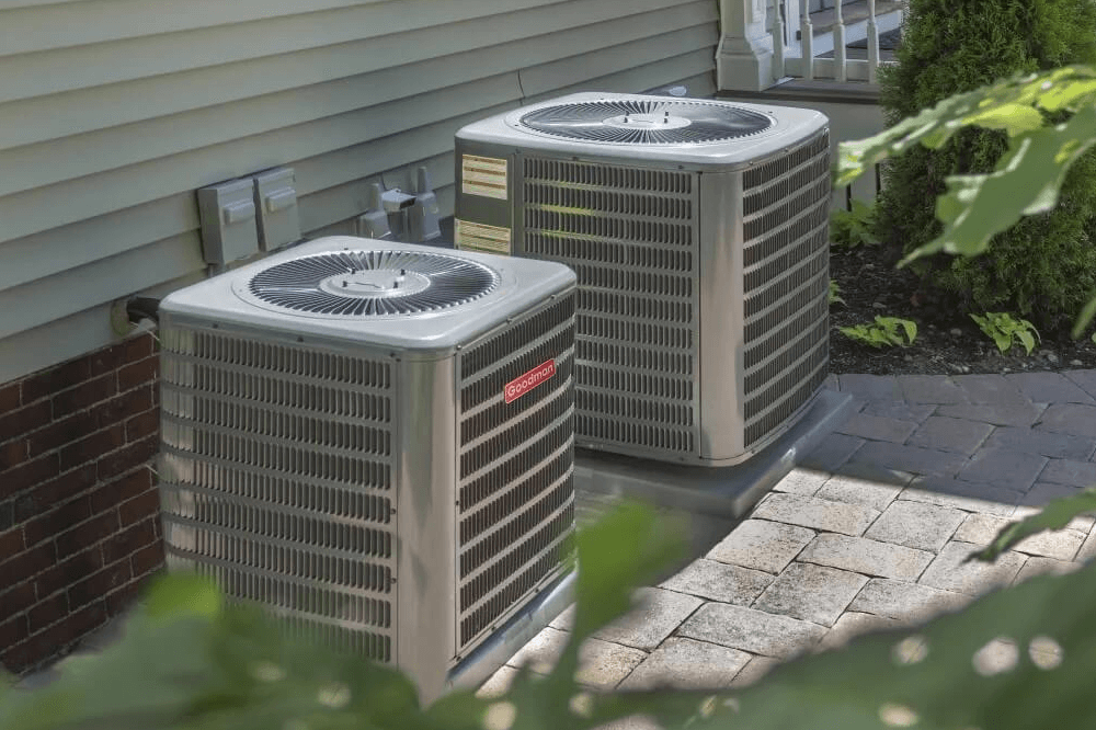 Two outdoor AC units in SouthWest Michigan awaiting service from the AC experts at J and J .